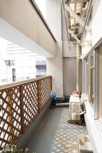 a balcony of a building with a vacuum at Nanei Building - Vacation STAY 04905v in Kagoshima