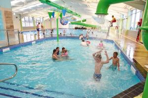 a group of people in a swimming pool at TSCaravan, Haven, Golden Sands in Mablethorpe
