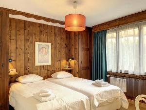 Ein Bett oder Betten in einem Zimmer der Unterkunft Apartment Cimeblanche 7