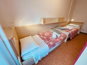 Postel nebo postele na pokoji v ubytování App4rent Saturno 4 - family apartment, wifi, parking