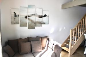 a dolphin in the ocean canvas wall art at Fleur de Ré in Loix