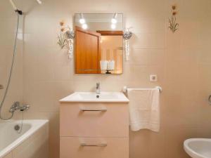 a bathroom with a sink and a mirror at Bugambilla in Playa de Muro +23 photos