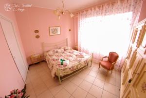 A bed or beds in a room at Bed & Breakfast L'Arengo