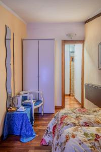 A bed or beds in a room at Affittacamere La Mansarda del Centro