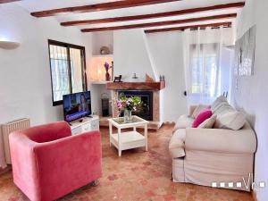 a living room with two couches and a tv at VH CostaBlanca - EL HORIZONTE in Benissa