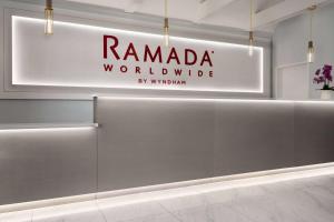 a sign that reads ramada worldwide in a room at Ramada by Wyndham Anaheim Convention Center in Anaheim