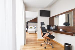 Televízia a/alebo spoločenská miestnosť v ubytovaní INX Design Hotel
