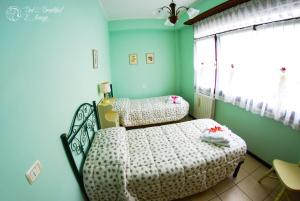 Giường trong phòng chung tại Bed & Breakfast L'Arengo