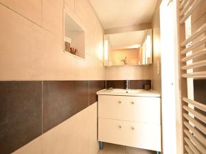 a bathroom with a sink and a mirror at Maison Les Portes-en-Ré, 3 pièces, 4 personnes - FR-1-434-94 in Les Portes