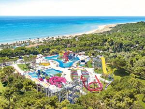 an aerial view of a water park next to the beach at Grecotel Ilia Palms & Aqua Park in Loutra Killinis