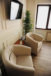 Un televizor și/sau centru de divertisment la pontevecchio rooms +44 fotografii