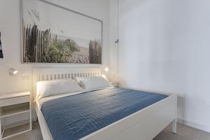 Кровать или кровати в номере Dimore al mare-Stelladelmare Fontanebianche