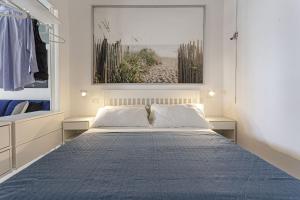 Кровать или кровати в номере Dimore al mare-Stelladelmare Fontanebianche