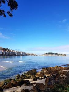 a view of the ocean from a rocky beach at Vista Azul in Baiona