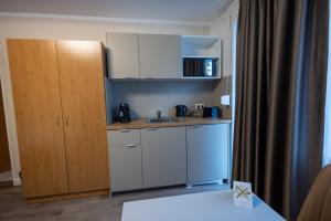 Kuchyň nebo kuchyňský kout v ubytování Hotel Schlangenbader Hof