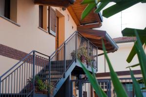 a staircase in a building with potted plants on it at "La Casetta" tra Milano, Monza e i laghi di Como e Lecco in Cesano Maderno