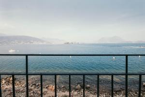 a view of the ocean from a fence at La casa sull'Isola Pescatori in Stresa