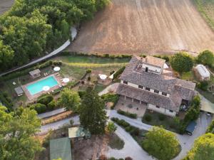 an aerial view of a house with a swimming pool at Torre Palombara - Dimora Storica in Narni