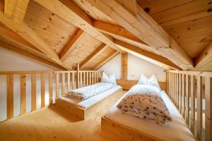 A bed or beds in a room at Eggerhof Fernblick