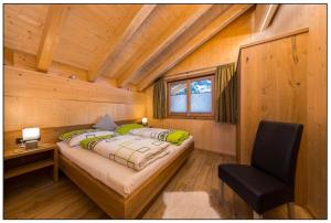 Ένα ή περισσότερα κρεβάτια σε δωμάτιο στο Ferienchalet Elisabeth