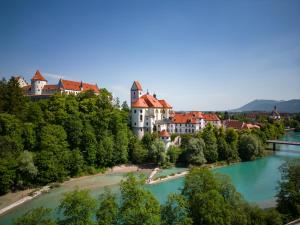 an aerial view of a town on the river at Hartungs Hoteldorf in Füssen