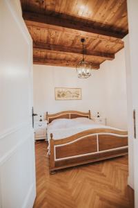 a bedroom with a bed and a wooden ceiling at Villa Ana in Ivanica +58 photos