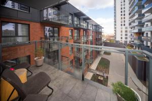a balcony of a building with chairs on it at Maya's Flats & Resorts 62 - 3 rooms apartment BASTION WALOWA Gdańsk in Gdańsk