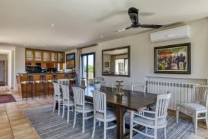 a dining room with a table and chairs at Luxury Golf Villa Torremirona in Navata