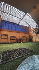 a room with a group of chairs at Comfy Apartment with private yard in 6 October city Cairo in 6th Of October