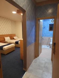 Lova arba lovos apgyvendinimo įstaigoje Nukhbat Faris 2 Hotel