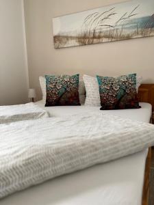 En eller flere senge i et værelse på Ferienwohnung Sonnenschein