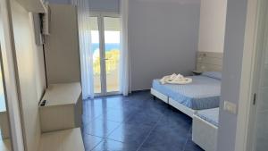 Postel nebo postele na pokoji v ubytování Hotel La Giara
