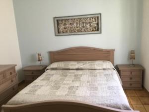 Кровать или кровати в номере Appartamenti Manuela