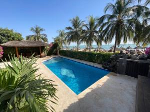 a swimming pool with a view of the beach at Agence Adjana Resort in Saly Portudal