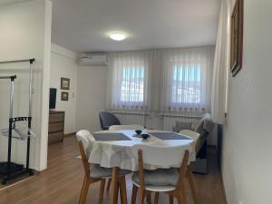 a dining room with a table and chairs in a room at Ottoman castle in Sarajevo