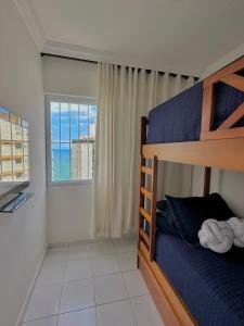 Postel nebo postele na pokoji v ubytování Melhor vista do Guarujá (Apartamento pé na areia)