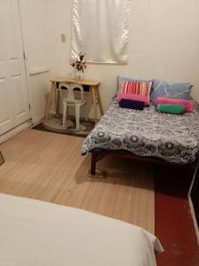 Ein Bett oder Betten in einem Zimmer der Unterkunft Maraño's Home