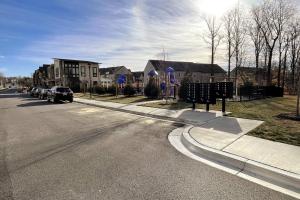 a street with cars parked on the side of the road at Capital Courts End unit My Luxe. in Upper Marlboro