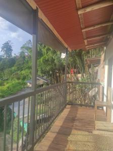 a balcony of a house with a view at Hostal y cabañas los Juanes in Jardin