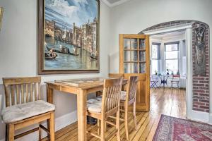 a dining room with a wooden table and chairs at Contemporary Jersey City Abode about 5 Mi to NYC! in Jersey City