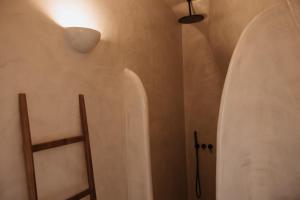 a room with two surfboards on the wall at Le Cote Oia in Oia