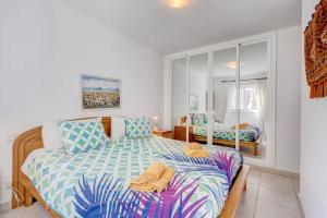a bedroom with two beds with towels on them at Los Gigantes Sea View in Santiago del Teide +17 photos