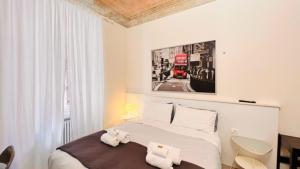 Łóżko lub łóżka w pokoju w obiekcie Piccole suite di charme