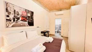 Łóżko lub łóżka w pokoju w obiekcie Piccole suite di charme