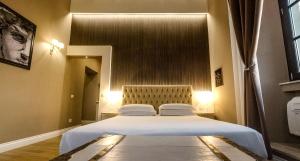 Llit o llits en una habitació de Il Borgo Your Luxury Suites