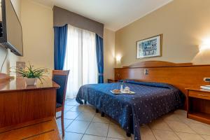 Postel nebo postele na pokoji v ubytování Hotel Relax