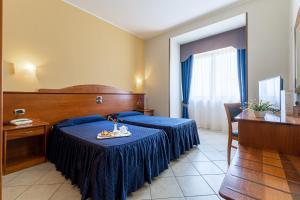 Postel nebo postele na pokoji v ubytování Hotel Relax