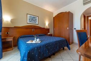 Postel nebo postele na pokoji v ubytování Hotel Relax