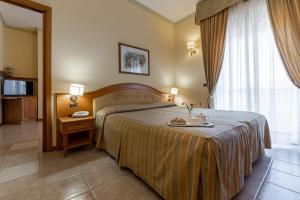 Postel nebo postele na pokoji v ubytování Hotel Relax