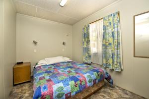 A bed or beds in a room at Albany Holiday Park